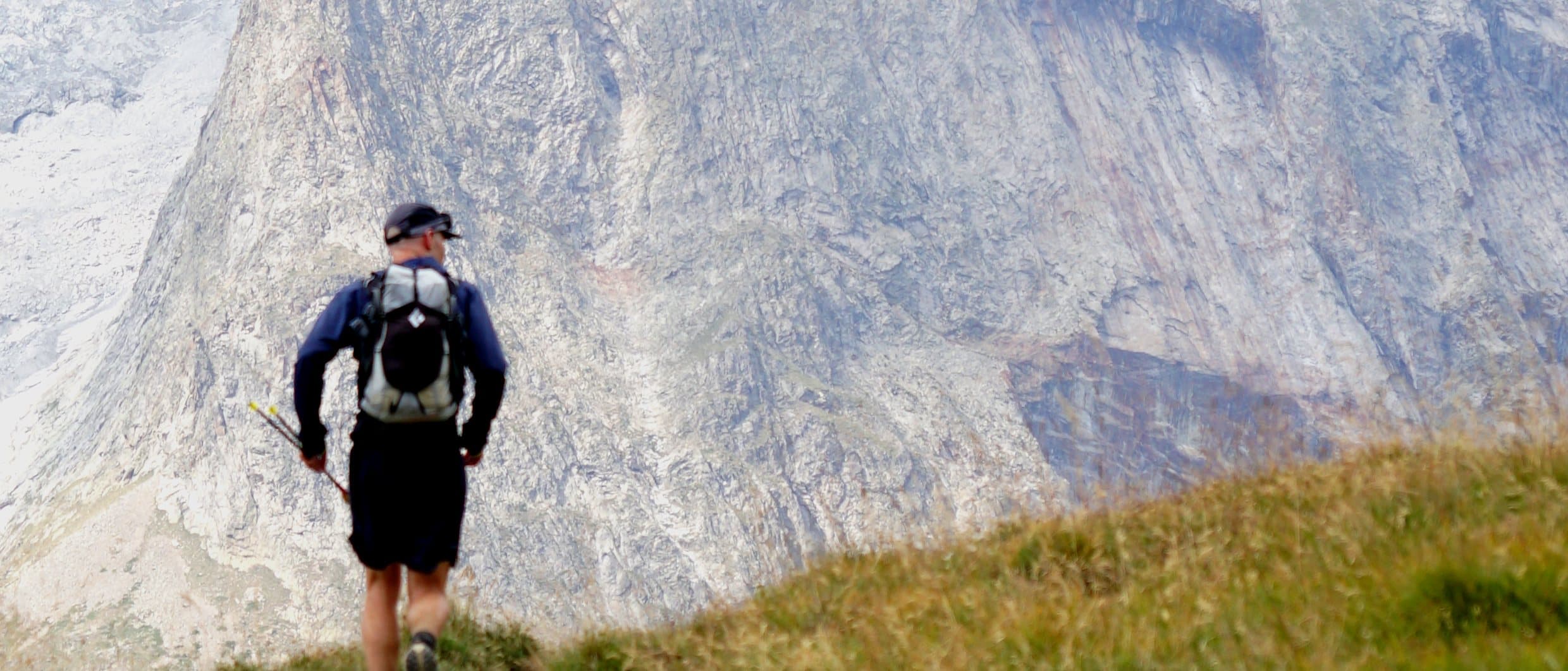 Anthony running a mountain trail on the Tour du Mont Blanc with a fastpacking vest
